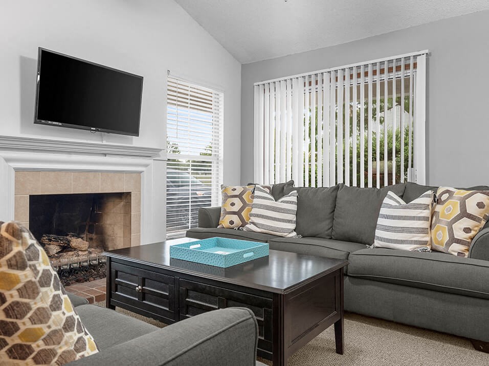 a living room with a couch and a television