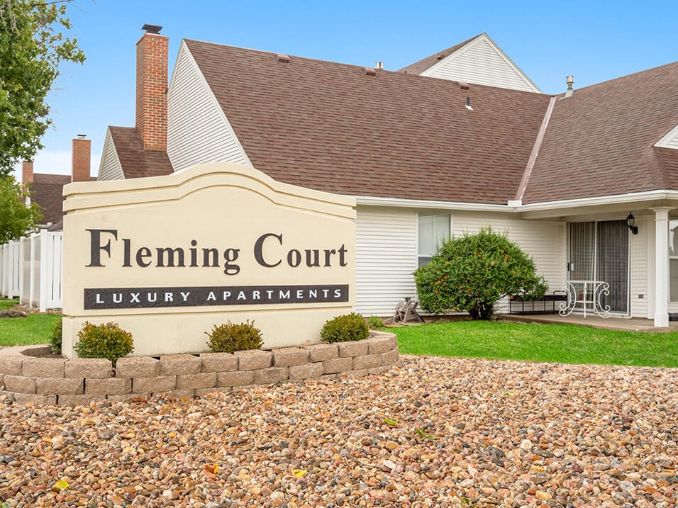 a building with a sign that reads flaming court luxury apartments