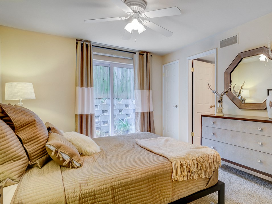 apartment bedroom with walk in closet and large window at the villages at general grant