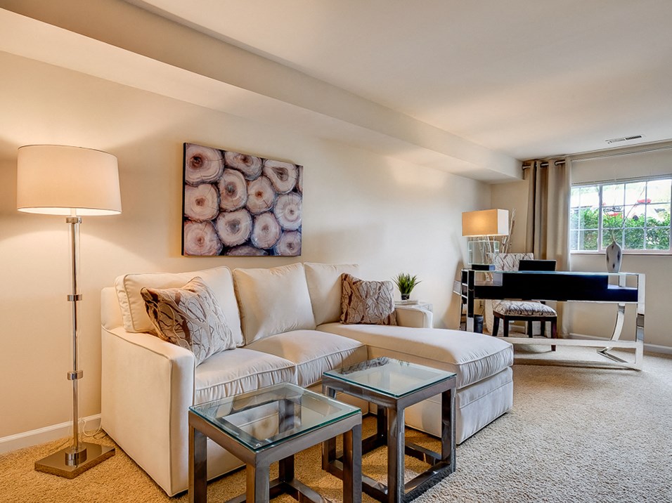 carpeted living room in apartment at the villages at general grant