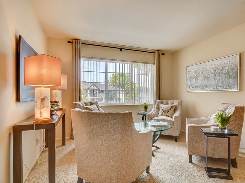Living room with large window at the villages at general grant apartments