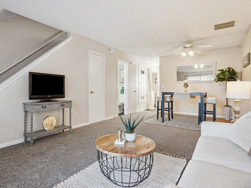 a living room with carpeting