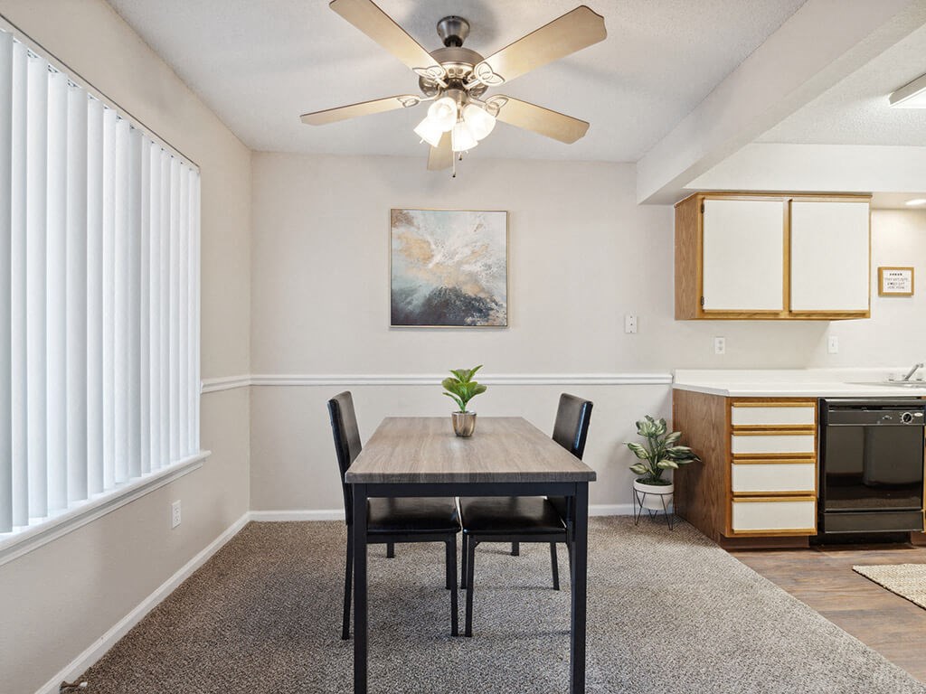 dining room with a table and a ceiling fan