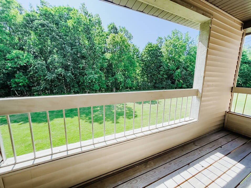 balcony overlooking woods at huntington glen apartments