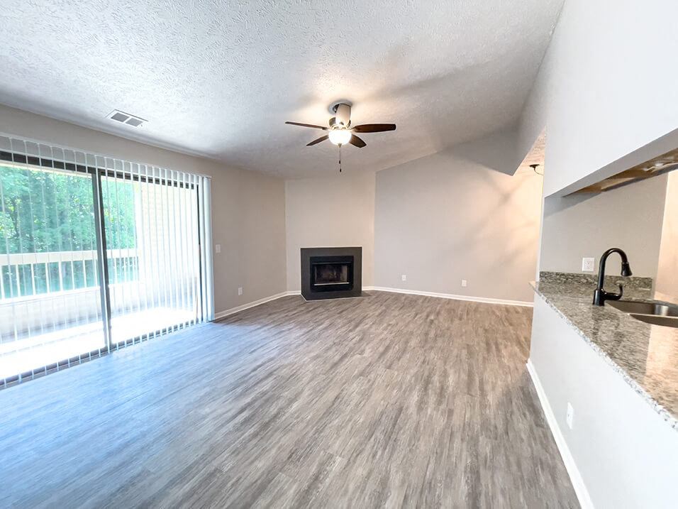 Huntington Glen living room with fireplace and vaulted ceiling