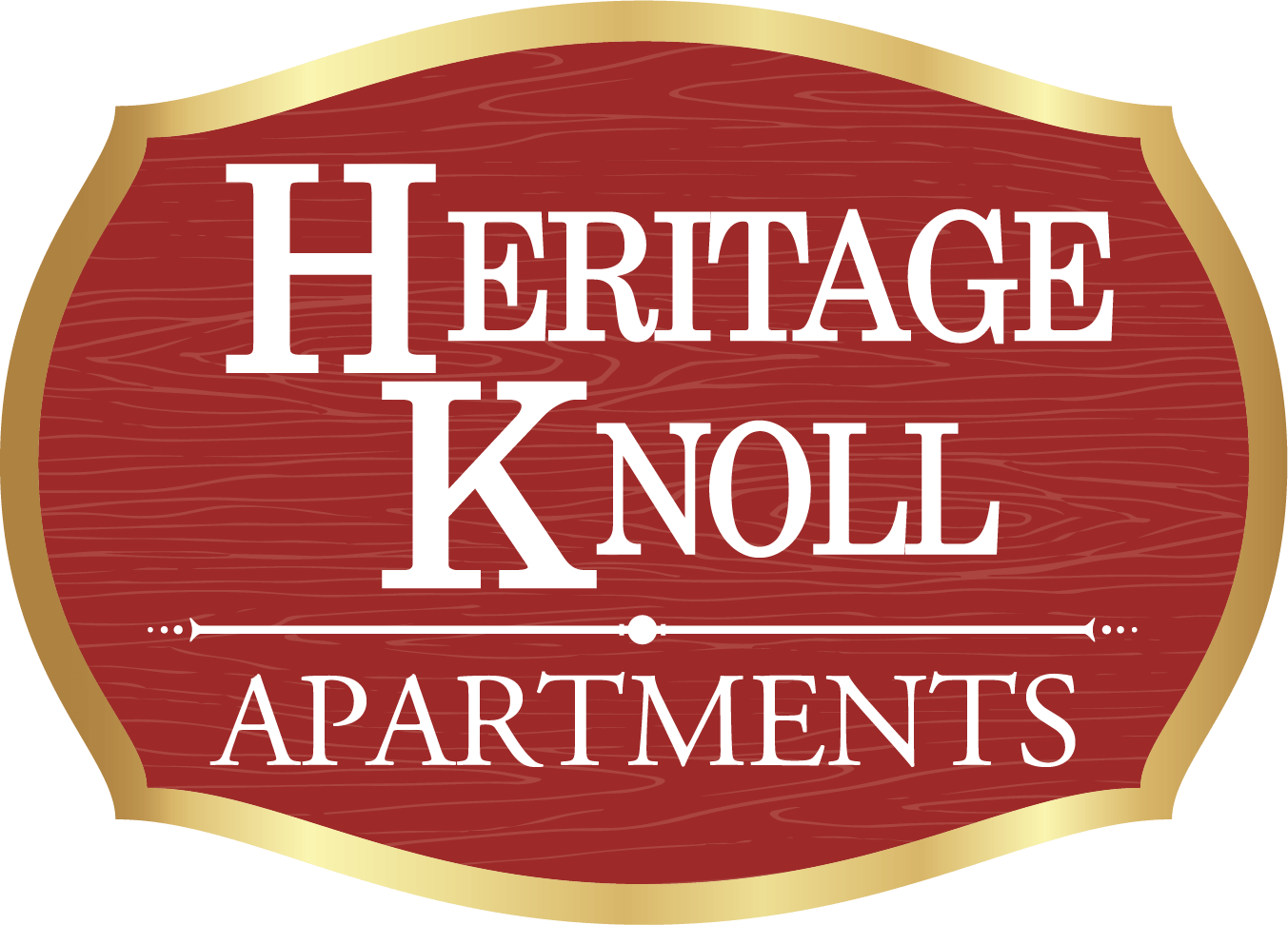 A sign that says "Heritage Knoll Apartments" in white text on a red background with a gold border.