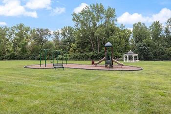 a park with a playground and a gazebo