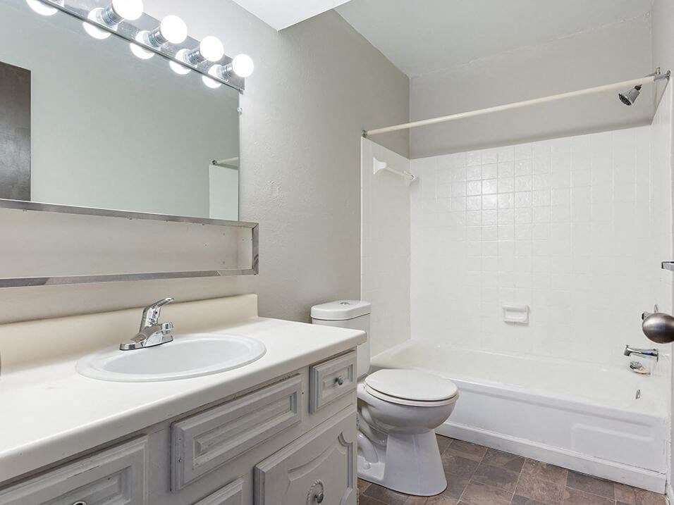 a bathroom with a sink toilet and a shower
