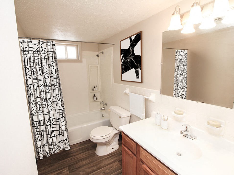 a bathroom with a toilet sink and bathtub