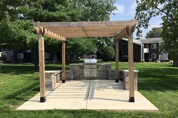 a pergola with grilling area at Indian Springs Apartments