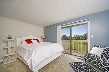 bedroom with balcony access at indian woods apartments