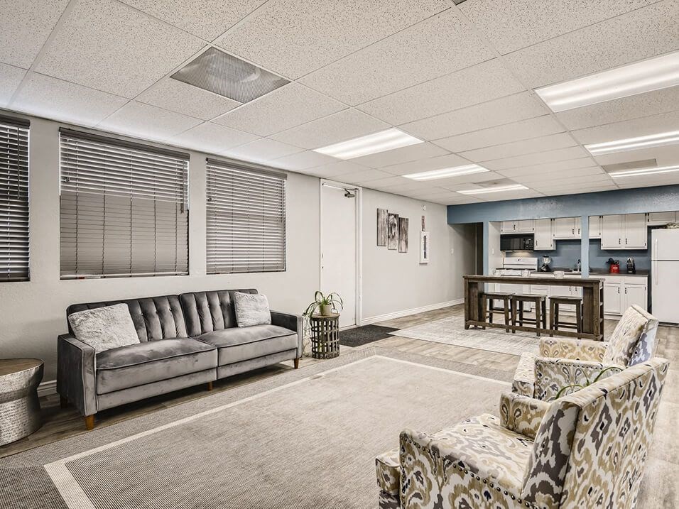 lounge area and kitchen in the clubhouse