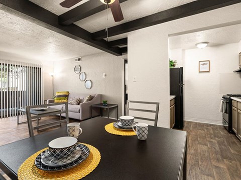 a dining room with a table and chairs