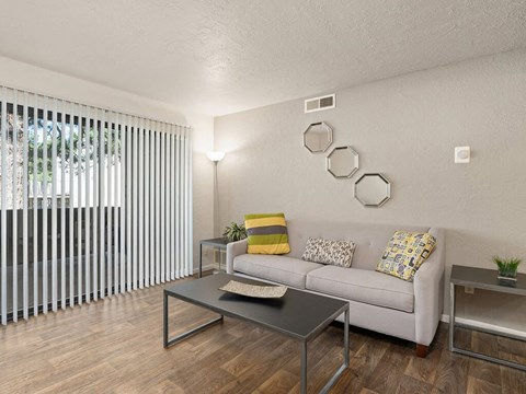 a living room with a couch and a table