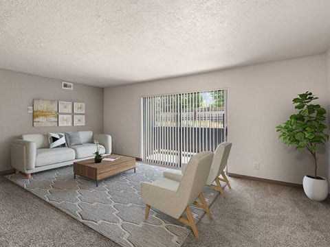 a living room with a couch and chairs and a table