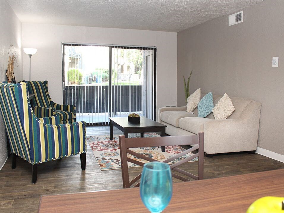 a living room with a couch a chair and a table