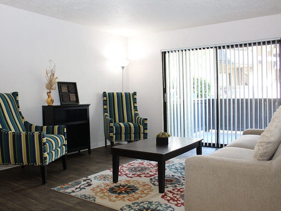 a living room with two chairs and a coffee table