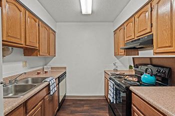 a kitchen with a stove and a sink