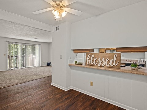 an empty living room with a closed sign on the wall