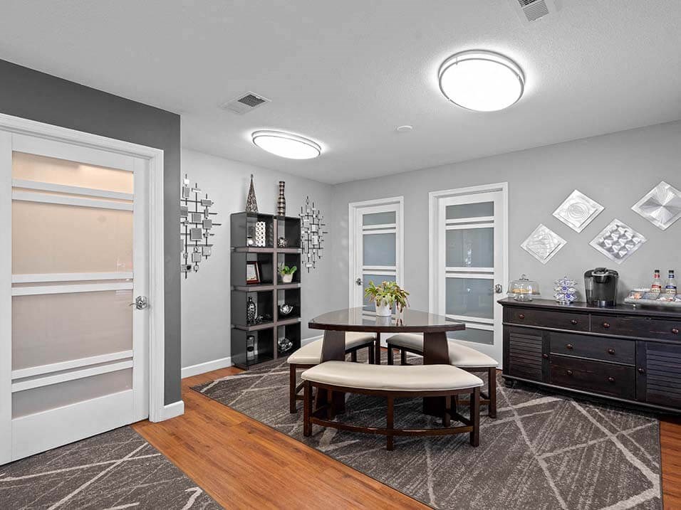 a dining room with a table and chairs