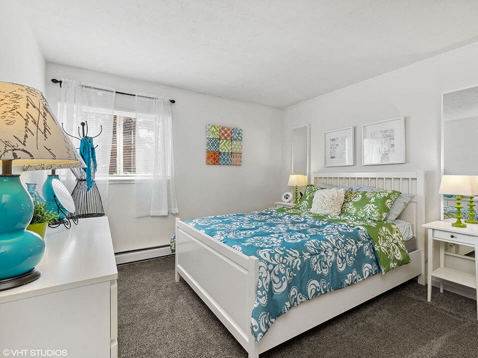 a bedroom with a window