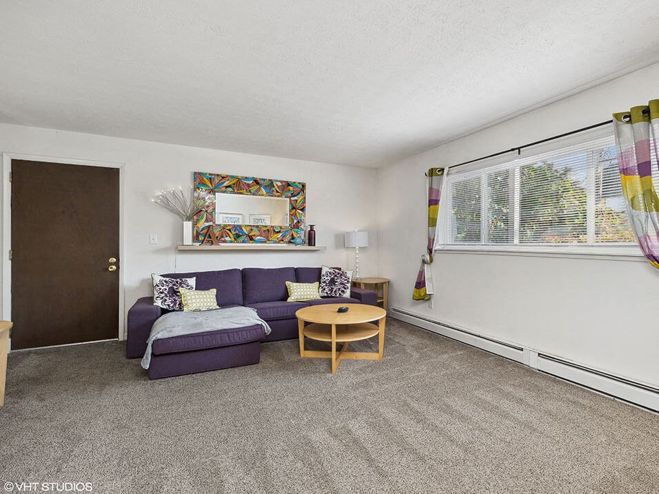 apartment living room with a purple couch