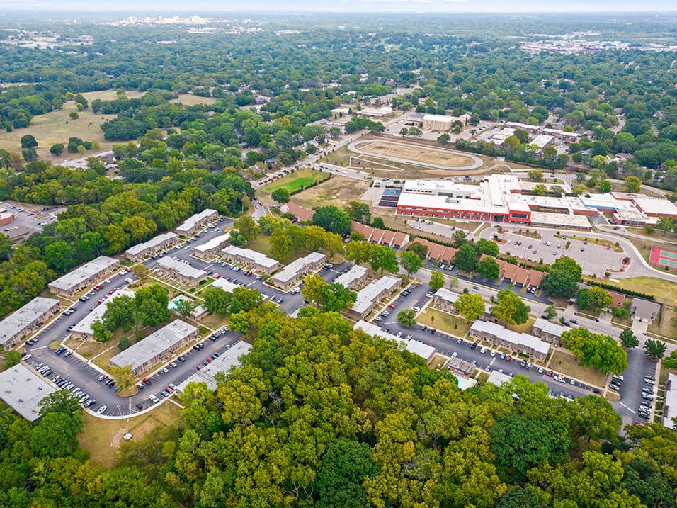 an aerial view of a city with buildings and trees
