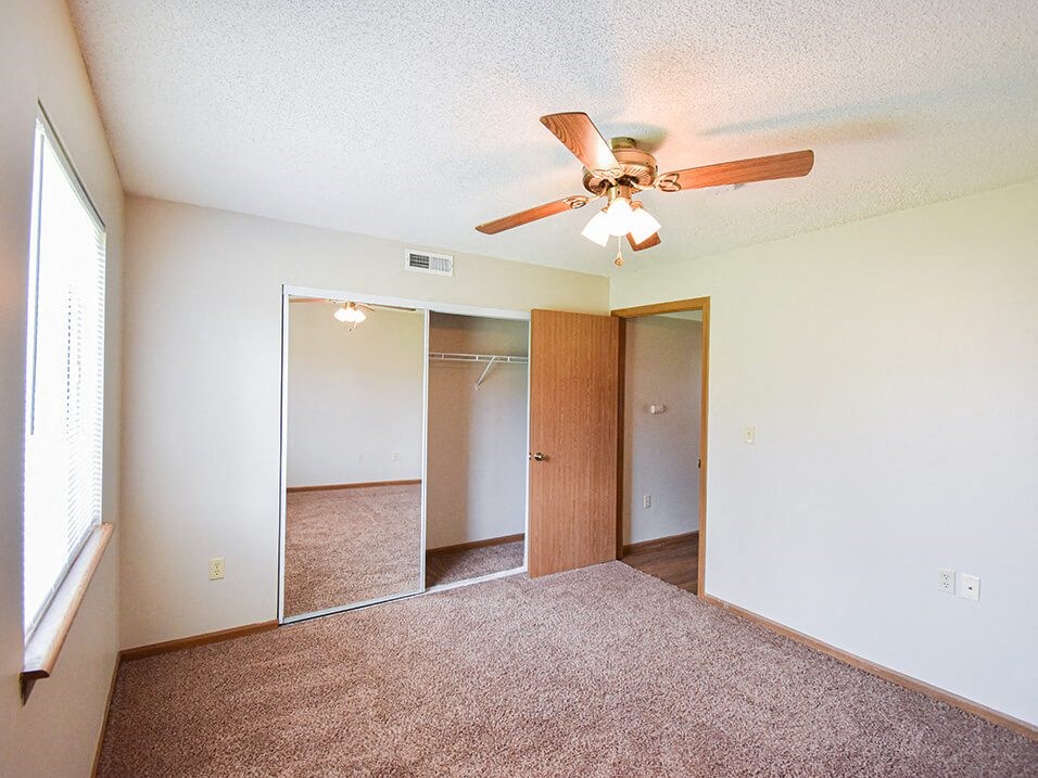 carpeted bedroom with natural light