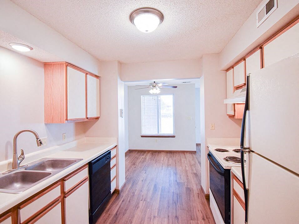 Kitchen with white cabinets and double sink