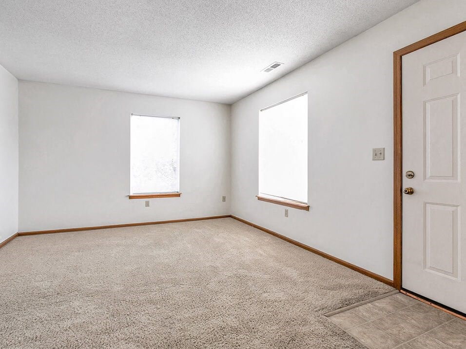 carpeted living area with natural light