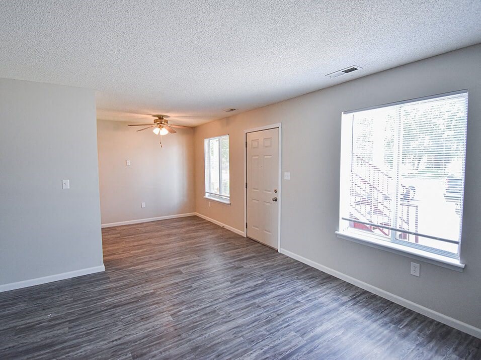 apartment entrance into living room with window