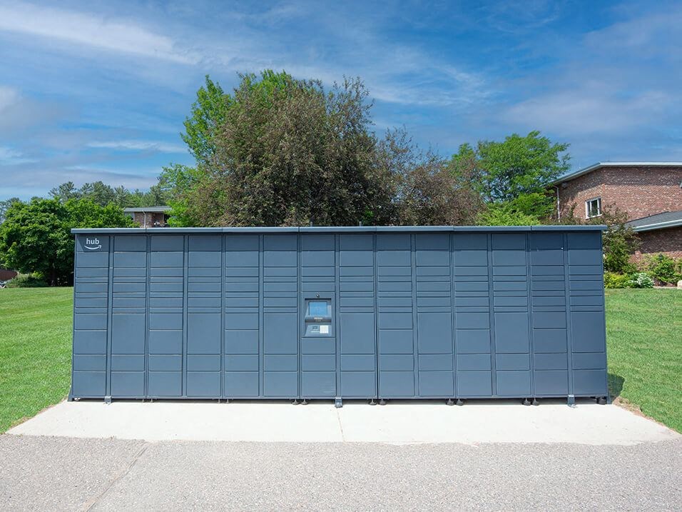 a large blue garage door in front of a grassy area