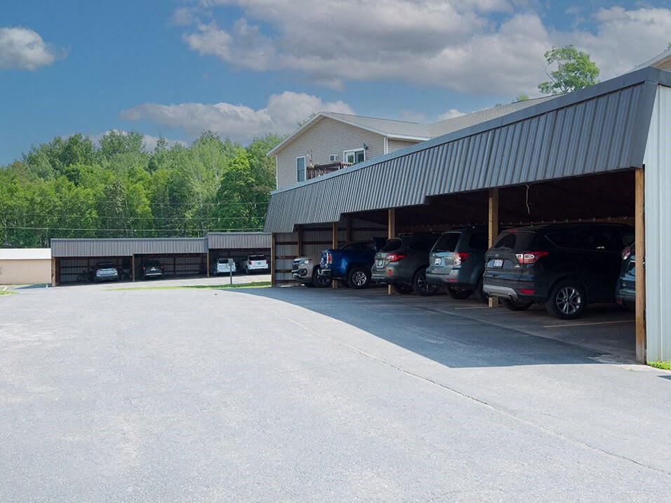 a parking lot with cars in it and a building in the background