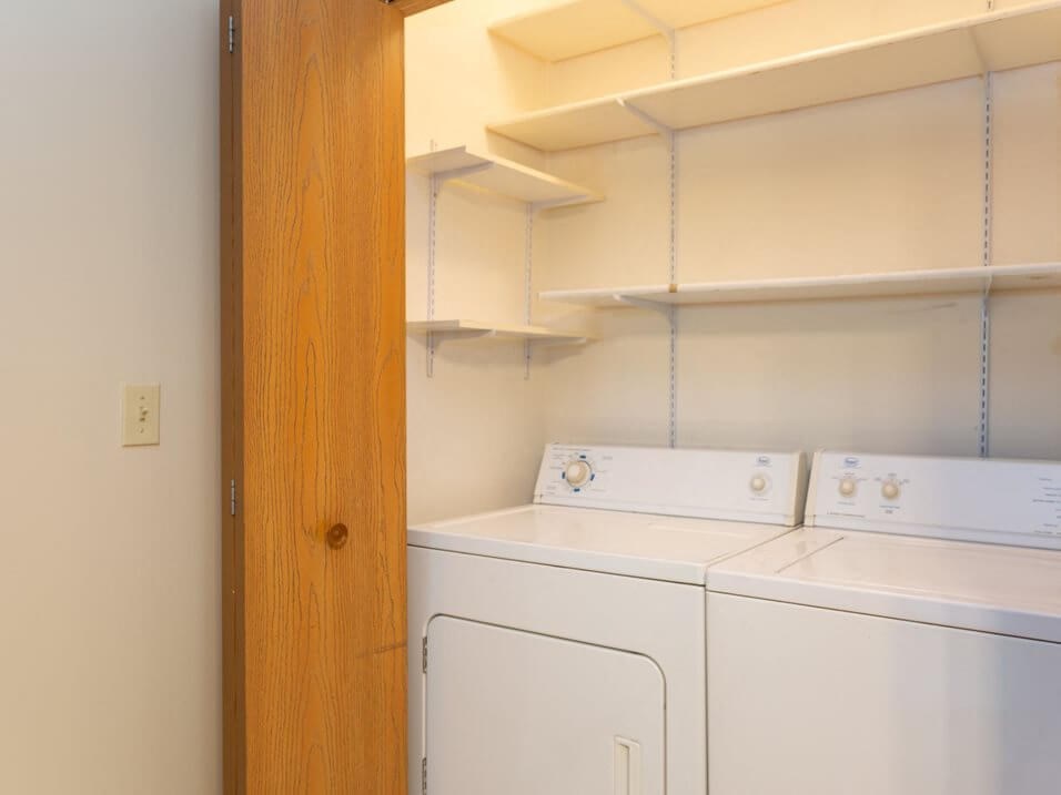 a laundry room with a washer and dryer