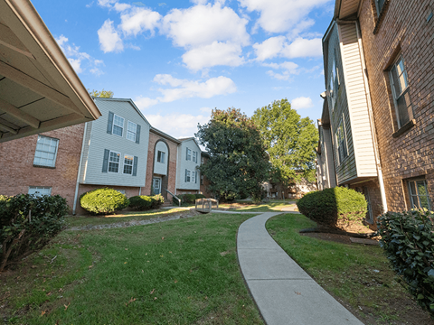 A residential area with houses and a walkway.