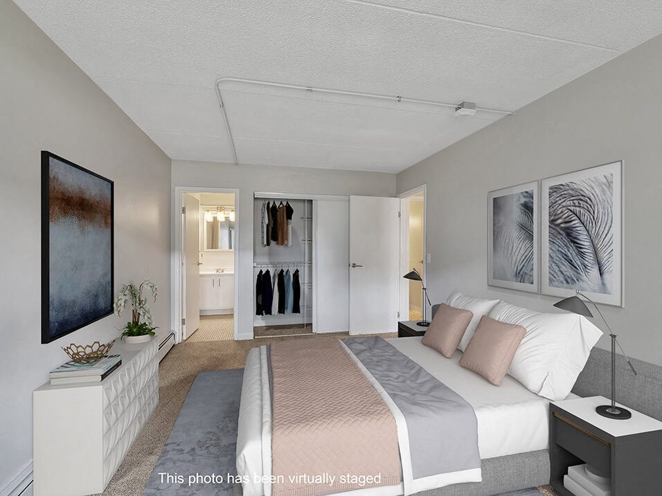 a bedroom with a bed and a closet