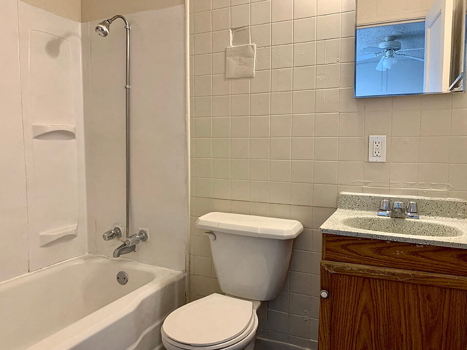a bathroom with a toilet sink and bathtub