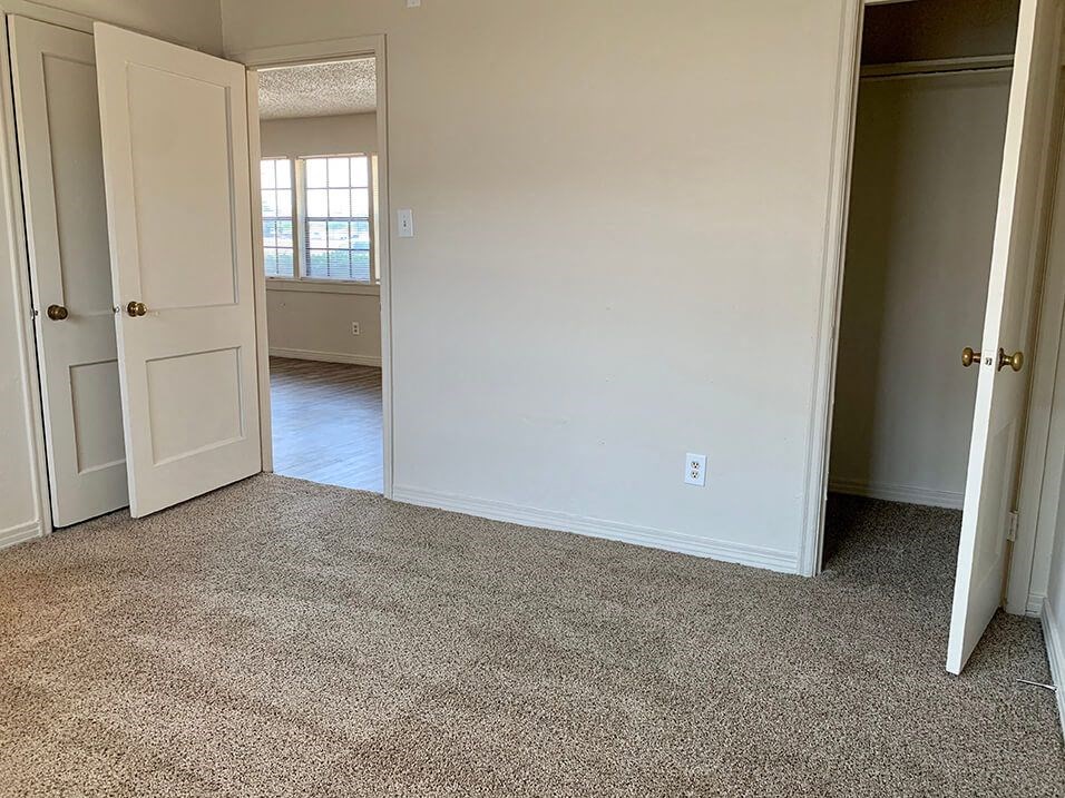 an empty room with a door open