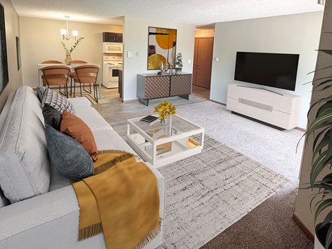 A living room with a grey couch and a coffee table.