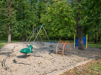 swings at Preston Oaks Apartments - Photo Gallery 9