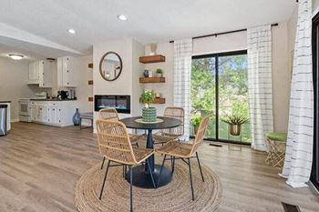 a dining room with a table and chairs