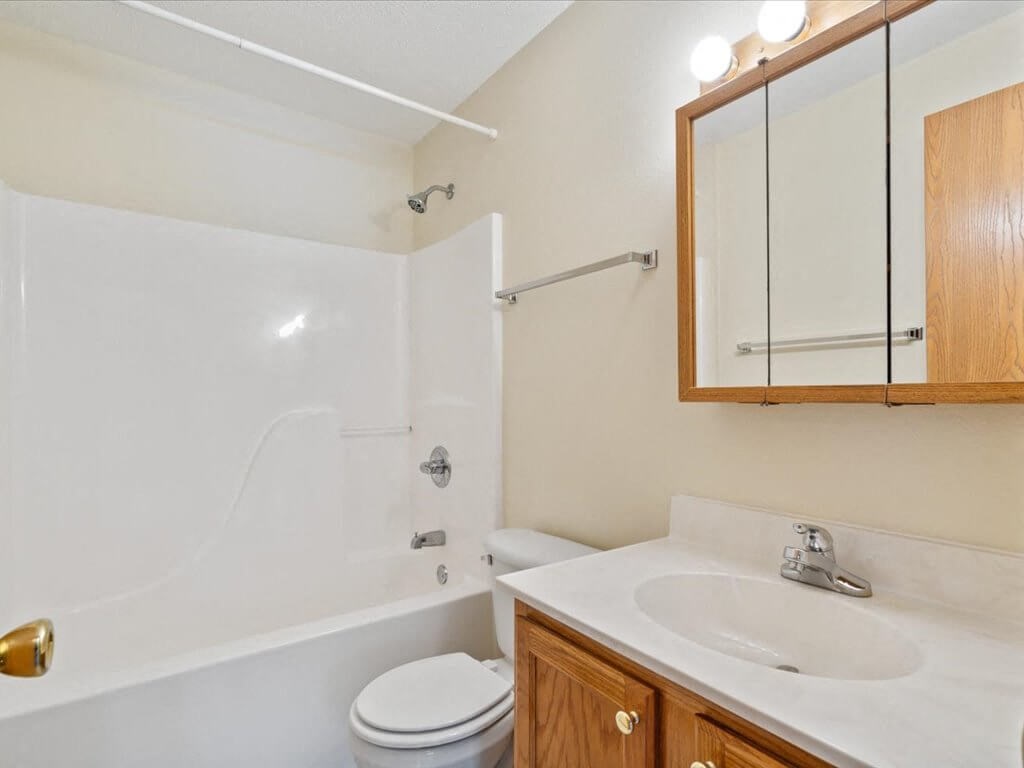 a bathroom with a tub shower