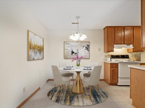 a kitchen and dining room with a table and chairs