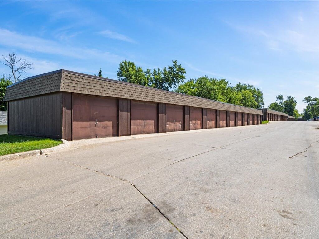 apartment complex with row of garages
