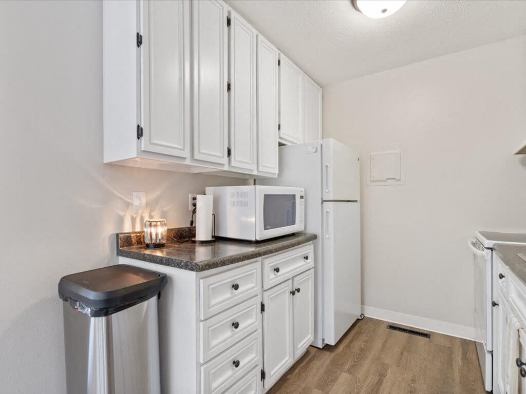 clubhouse kitchen with a microwave and a refrigerator