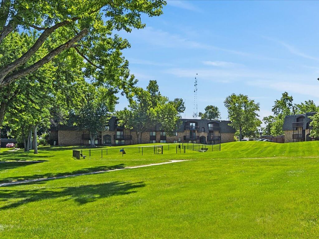 apartment community with green grass