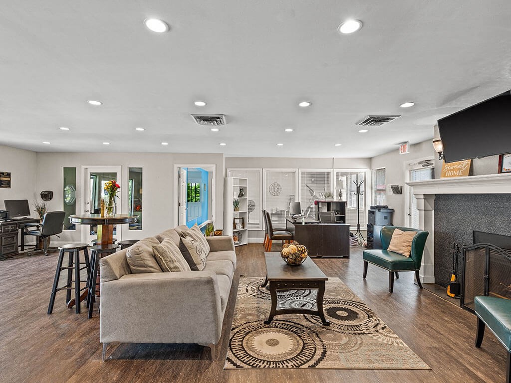 a living room with a couch and a fire place