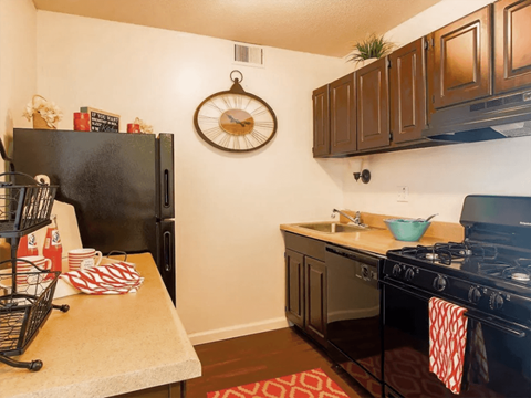 a kitchen with a stove and a refrigerator