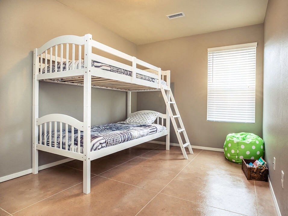 a bunk bed in a room with a ladder