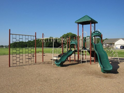 a playground with slides at a park